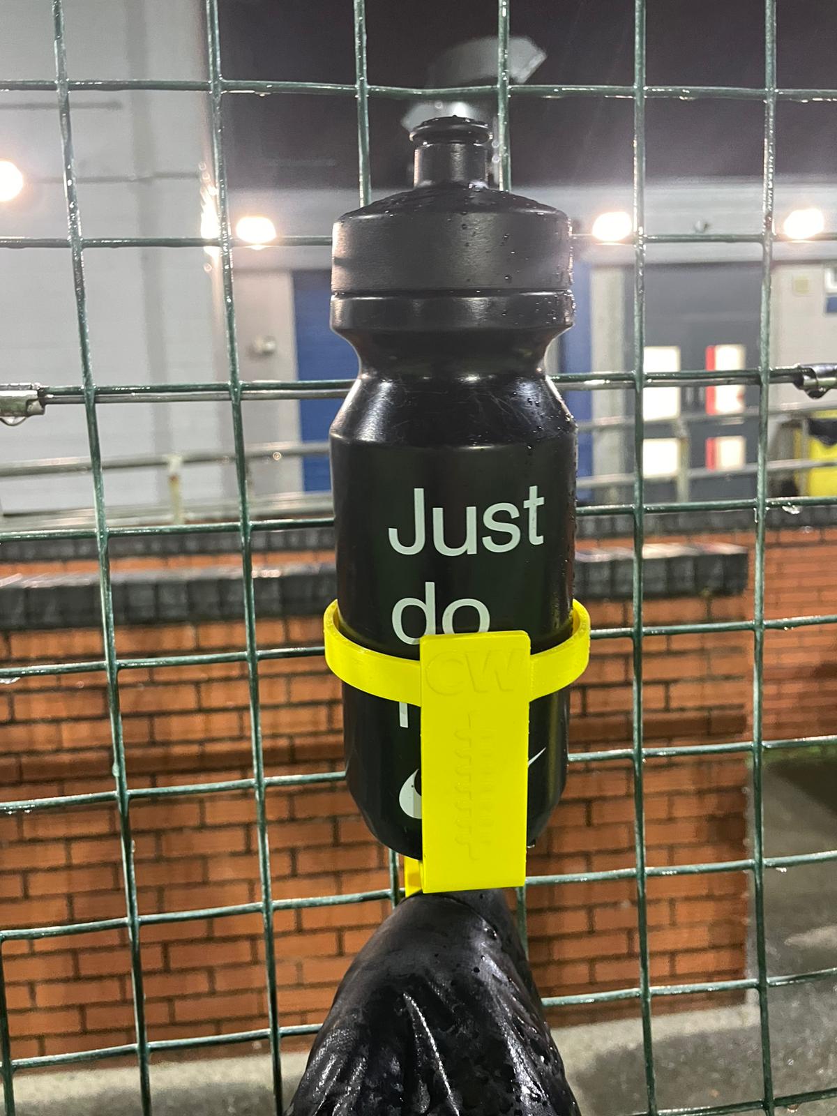 DeadLaces Hang Stuff Bottle It hooks holding football kit bags and coats off the muddy wet ground on the sideline