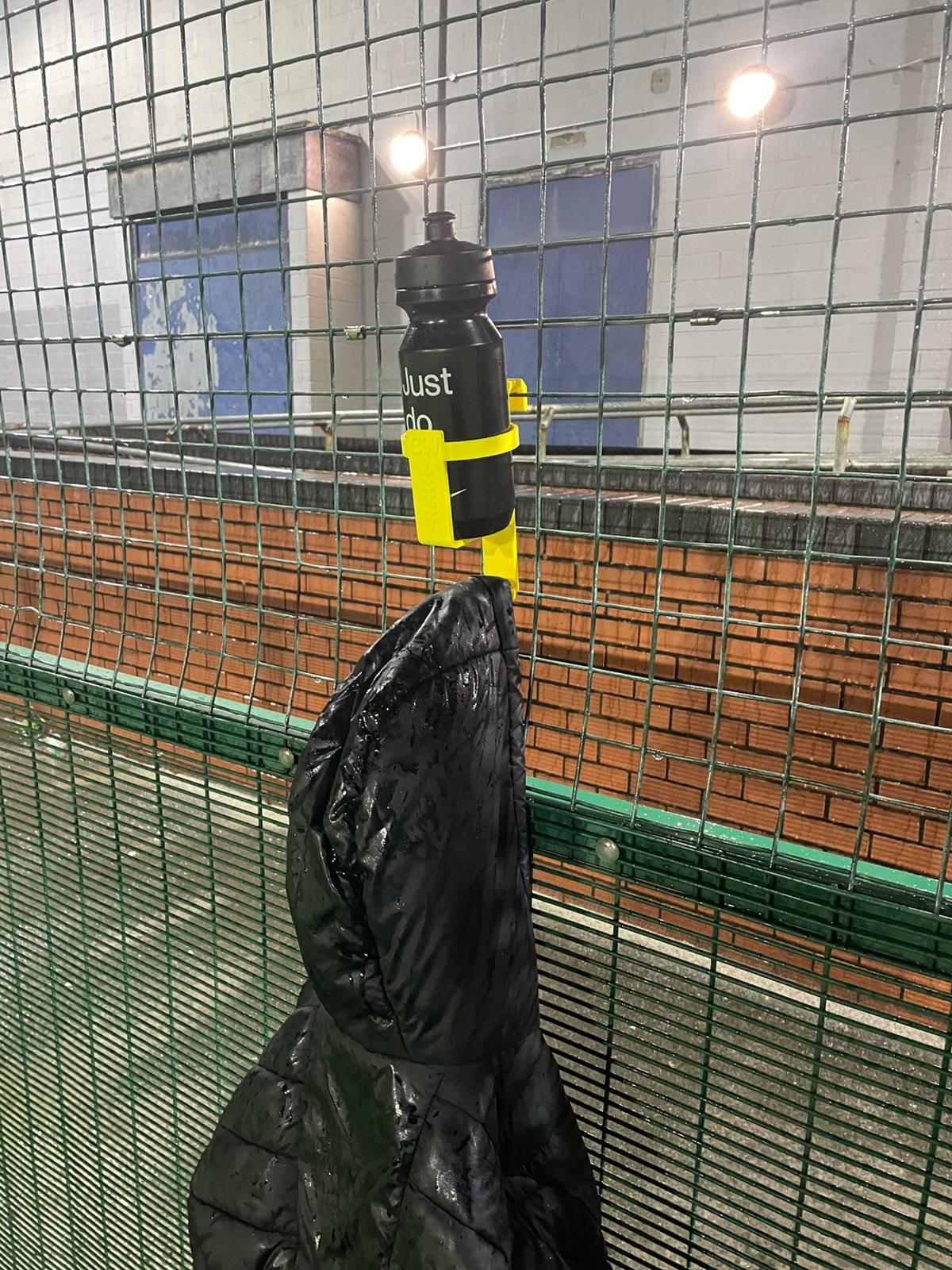 DeadLaces Hang Stuff Bottle It hooks holding football kit bags and coats off the muddy wet ground on the sideline